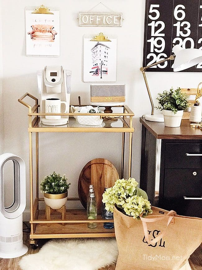 Decorating a shared office, with colorful industrial style. Her side is pink and gold, while his is black and neutrals. Check out the gold coffee cart!! Get all the details of this shared home office space at TidyMom.net