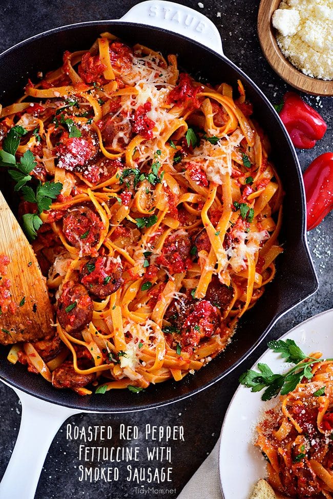 Delicious Roasted Red Pepper Fettuccine with Smoked Sausage in white Staub skillet