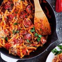 Roasted Red Pepper Fettuccine with Smoked Sausage in skillet
