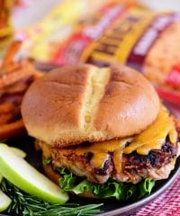 Apple Cheddar Pork Burgers are a simple dinner solution the whole family will devour!! Made with just five ingredients and packed with flavor, tart apples and sharp cheddar (inside and out) are going to elevate your burgers to a whole new dimension with an unexpected flavor that everyone is going to love! Print full recipe at TidyMom.net #burgers #pork #cheese