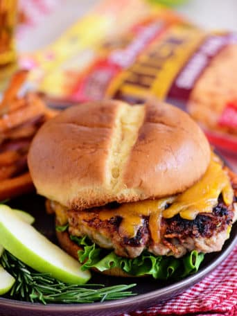 Apple Cheddar Pork Burgers are a simple dinner solution the whole family will devour!! Made with just five ingredients and packed with flavor, tart apples and sharp cheddar (inside and out) are going to elevate your burgers to a whole new dimension with an unexpected flavor that everyone is going to love! Print full recipe at TidyMom.net #burgers #pork #cheese