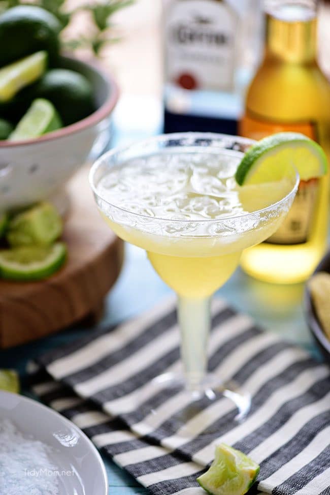 This easy recipe for a Beer Margarita has only 3 ingredients and is dripping with Mexican flavors. The best Beergarita is light, not too sweet, refreshing and super easy, to make! When you combine tequila, beer, and frozen limeade, you have something for the cocktail lover and brewski lover. Perfect for Cinco de Mayo or any celebration! Get this #cocktailrecipe at TidyMom.net #margarita #cocktails