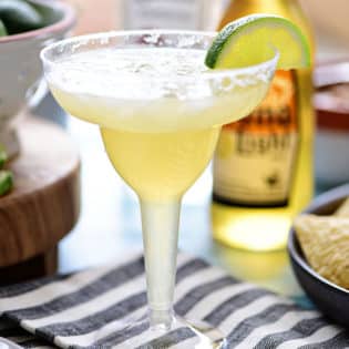 This easy recipe for a Beer Margarita has only 3 ingredients and is dripping with Mexican flavors. The best Beergarita is light, not too sweet, refreshing and super easy, to make! When you combine tequila, beer, and frozen limeade, you have something for the cocktail lover and brewski lover. Perfect for Cinco de Mayo or any celebration! Get this #cocktailrecipe at TidyMom.net #margarita #cocktails