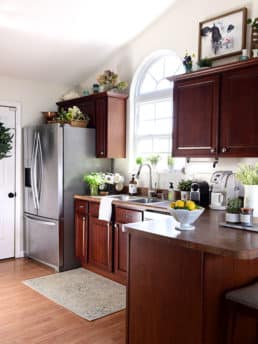 kitchen with cherry cabinets and creamy white walls