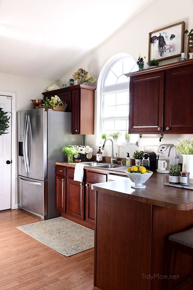 kitchen with cherry cabinets and creamy white walls