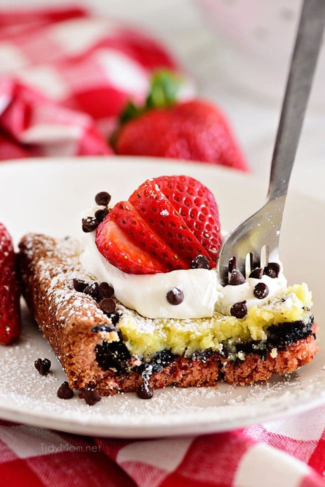 fork digging into a piece of Strawberry Gooey Butter Cake