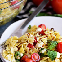Caprese Pasta Salad is fresh, easy and a perfectly simple for summer potlucks and BBQs. It has all the flavors of a traditional Caprese salad in pasta form!