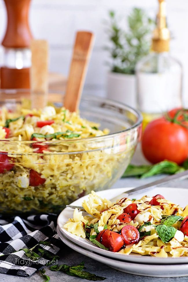 Caprese Pasta Salad is fresh, easy and a perfectly simple for summer potlucks and BBQs. It has all the flavors of a traditional Caprese salad in pasta form! 