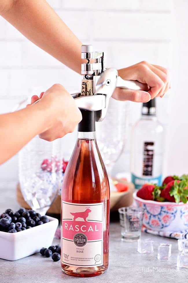 Pink Summer Sangria with berries. Opening bottle of rose with The Original Rabbit Cork Screw