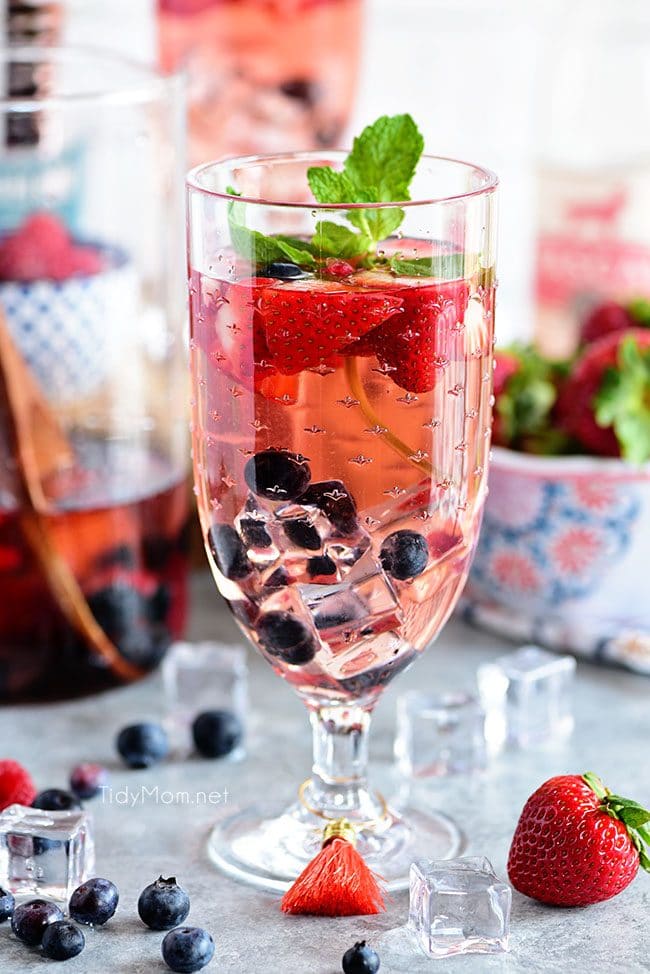 Pink Summer Sangria with berries.