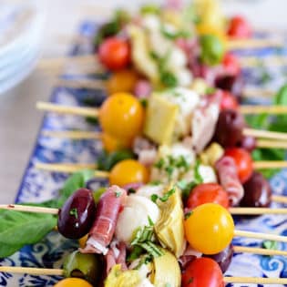 Wow your guests with bright and flavorful antipasto skewers. An easy make-ahead appetizer with a new delicious discovery in every bite. Perfect for any occasion, this party food comes together fast and is endlessly customizable. Print the recipe at TidyMom.net