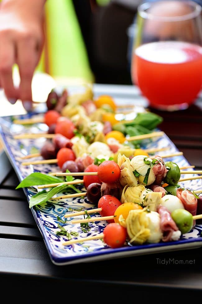 Wow your guests with bright and flavorful antipasto skewers. An easy make-ahead appetizer with a new delicious discovery in every bite. Perfect for any occasion, this party food comes together fast and is endlessly customizable. Print the recipe at TidyMom.net