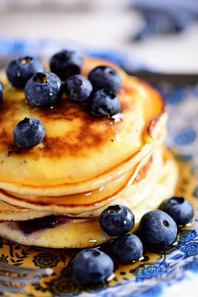 A stack of the Best Homemade Blueberry Pancakes. Print the full recipe at TidyMom.net