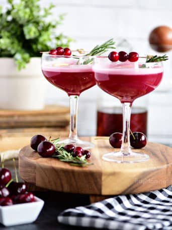 The fruity cherry and cranberry notes in this Cran-Cherry Rye Whiskey Sour Cocktail complement the spicy rye and tone down its bite.  An egg white in my cocktail? You betcha! Utterly the perfect cocktail for winter or any time of year.