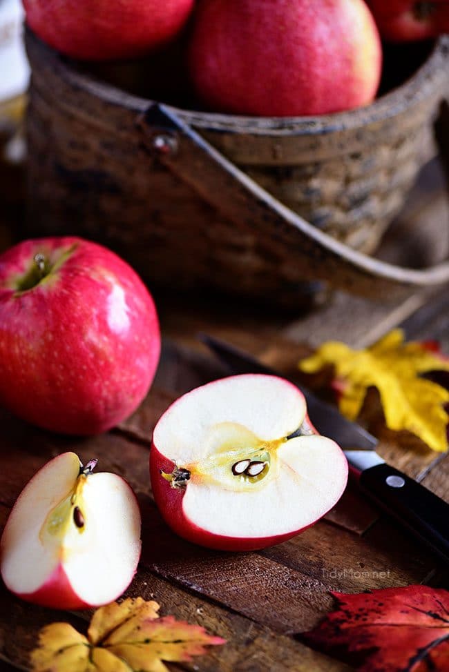 sliced apple and fall apples in a basket