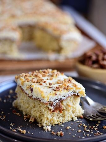 Caramel Butter Pecan Cake With Bourbon Frosting sliced on a plate