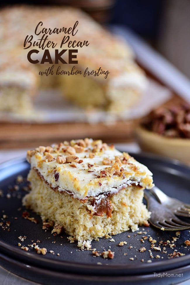 Caramel Butter Pecan Cake With Bourbon Frosting on black plate