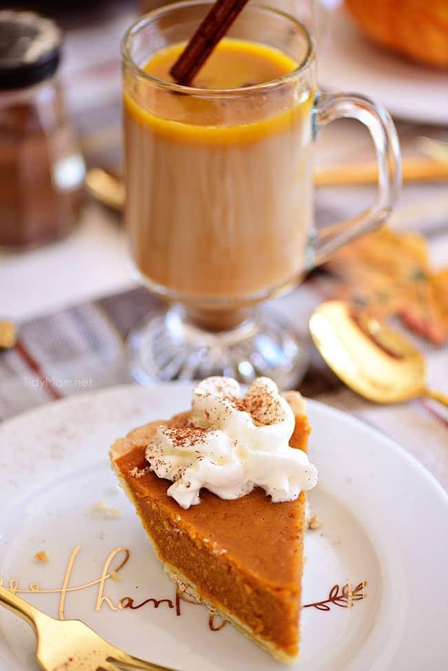 Pumpkin Spice Hot Buttered Rum with piece of pumpkin pie