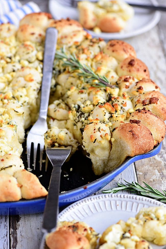 Cheesy Pull-Apart Garlic Bread with forks in skillet