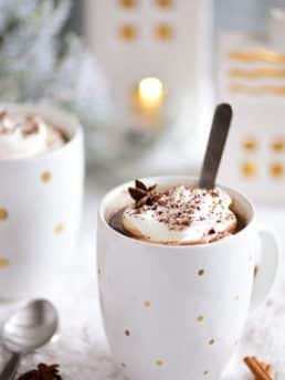 Butterscotch Schnapps Spiked Hot Chocolate in mugs with spoon