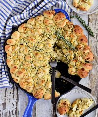 Cheesy Pull-Apart Garlic Bread dished up on plate from skillet