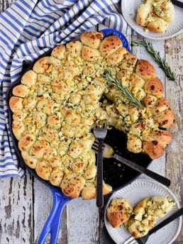 Cheesy Pull-Apart Garlic Bread dished up on plate from skillet