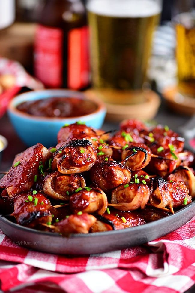 BBQ Bacon Wrapped Chicken Bites on plate with red checked napkin