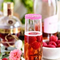 Raspberry Kir Royale cocktail in champagne flute