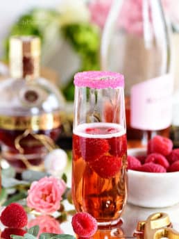 Raspberry Kir Royale cocktail in champagne flute