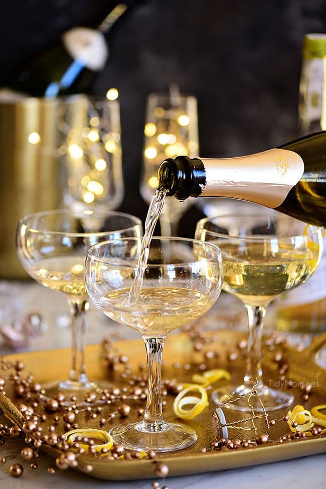 Pouring champagne for a Twinkle cocktail 