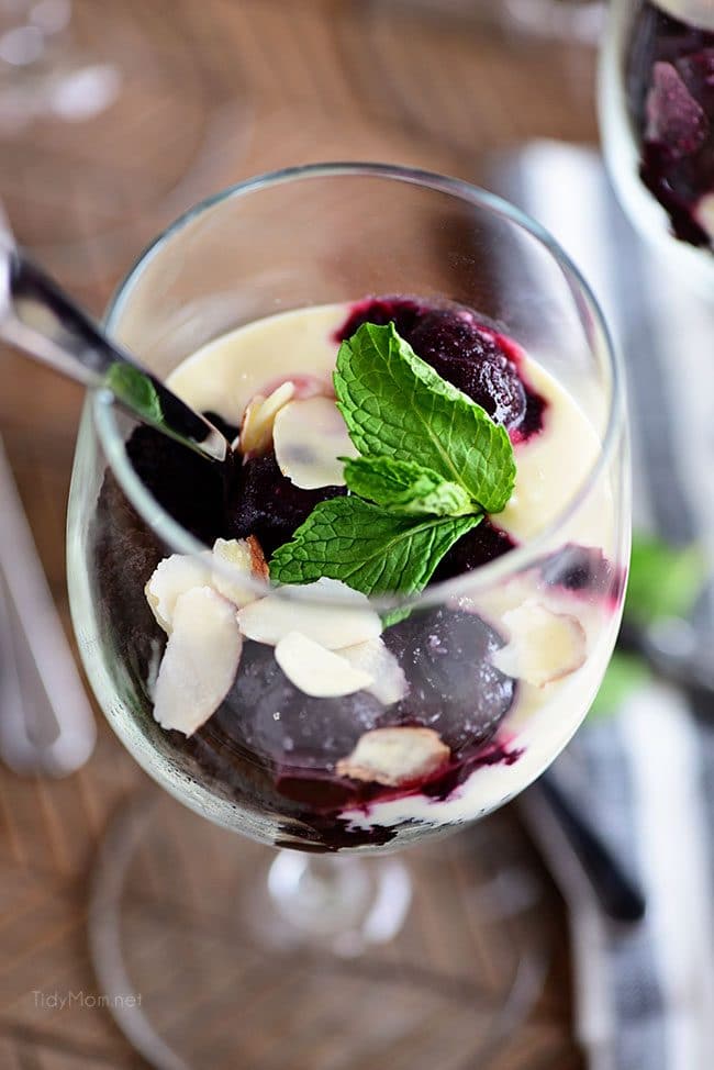 Cherry Almond Cheesecake Parfaits in wine glasses