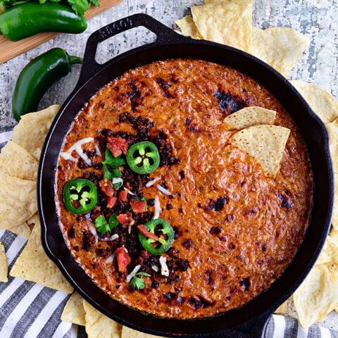 Creamy Chorizo Cheese Dip in cast iron skillet and chips