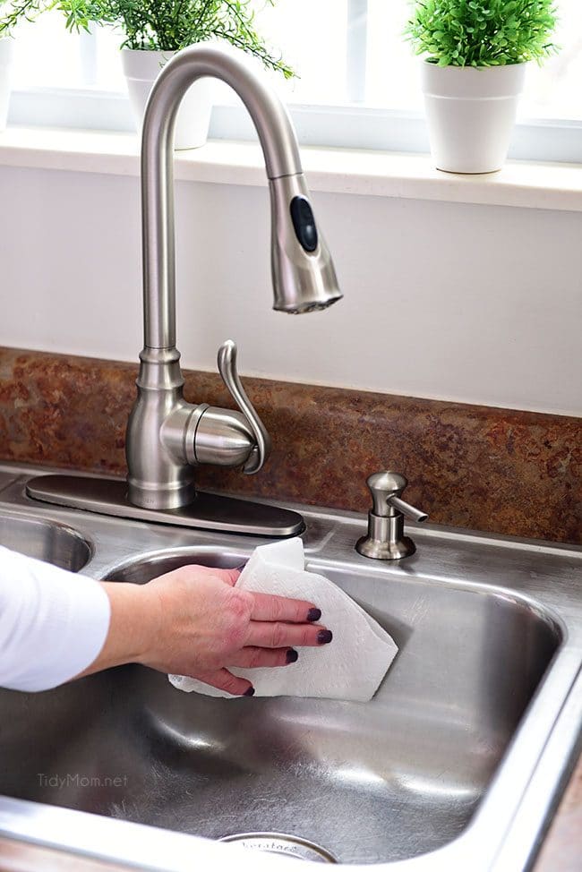 use a paper towel to clean the sink to reduce cross contamination of germs in the kitchen