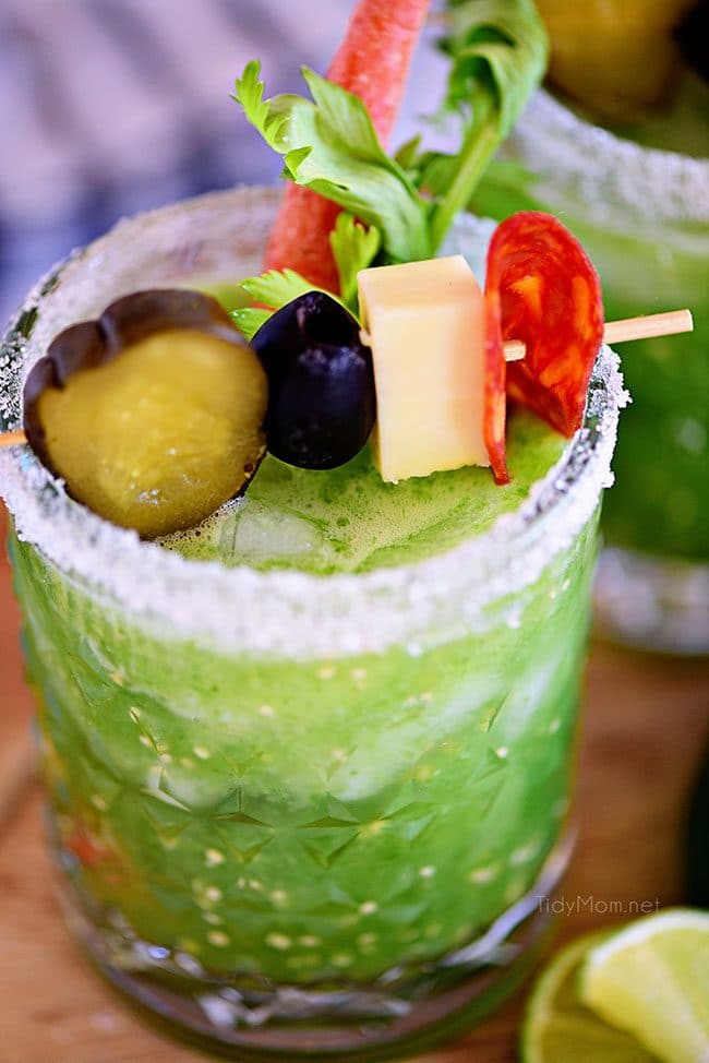 Verde Mary or Green Bloody Mary with garnishes in cocktail glass