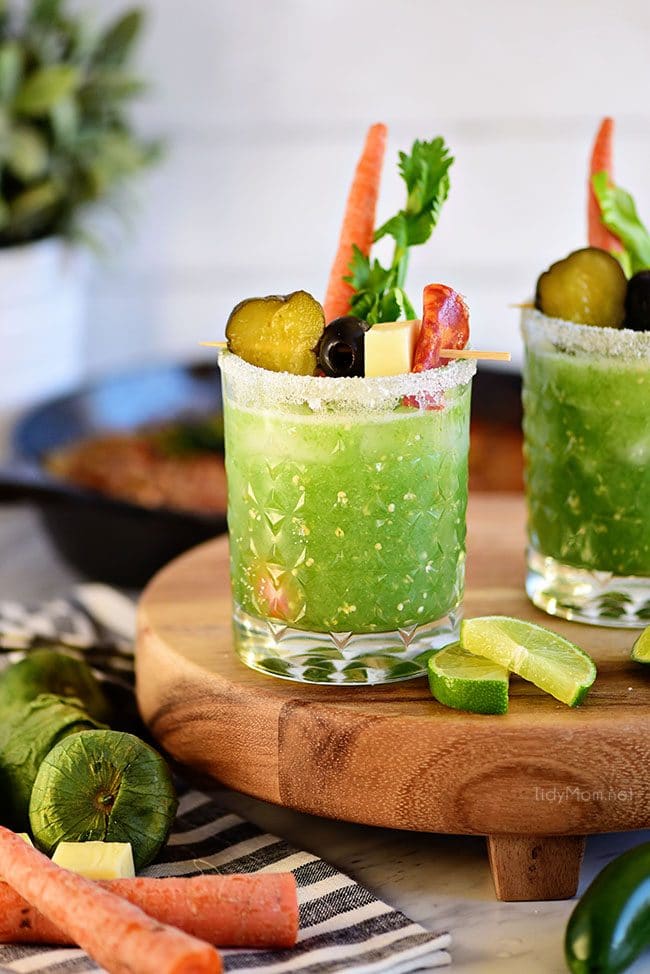 Verde Mary or Green Bloody Mary on track with lime slices