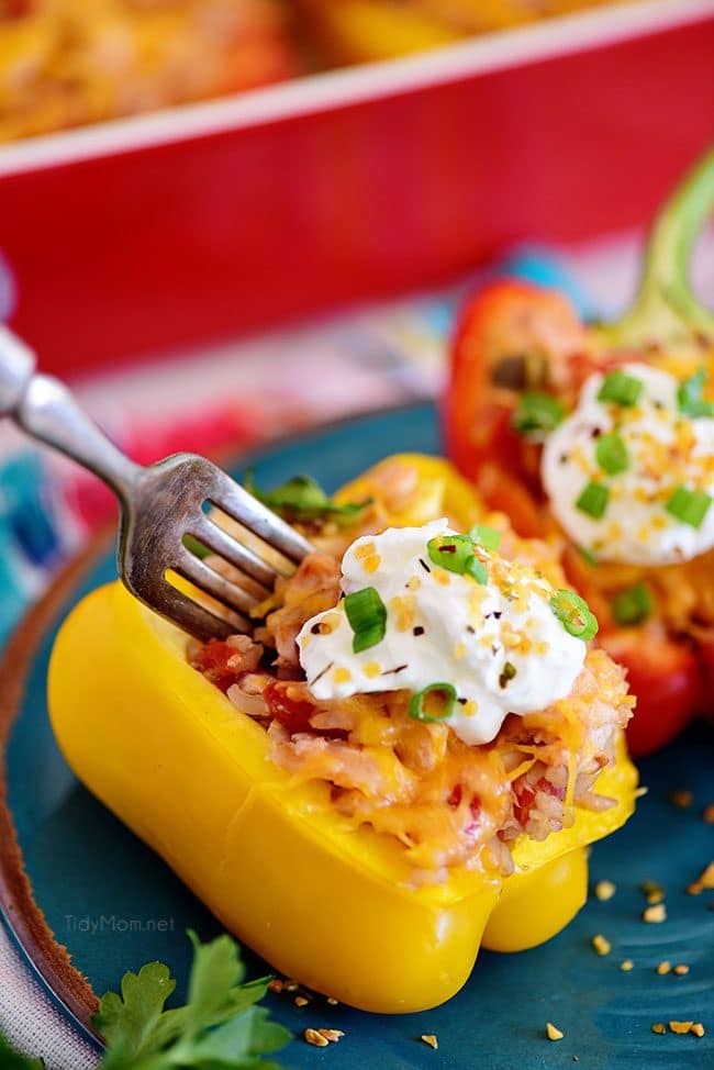 Yellow Chicken Stuffed Peppers on plate with fork