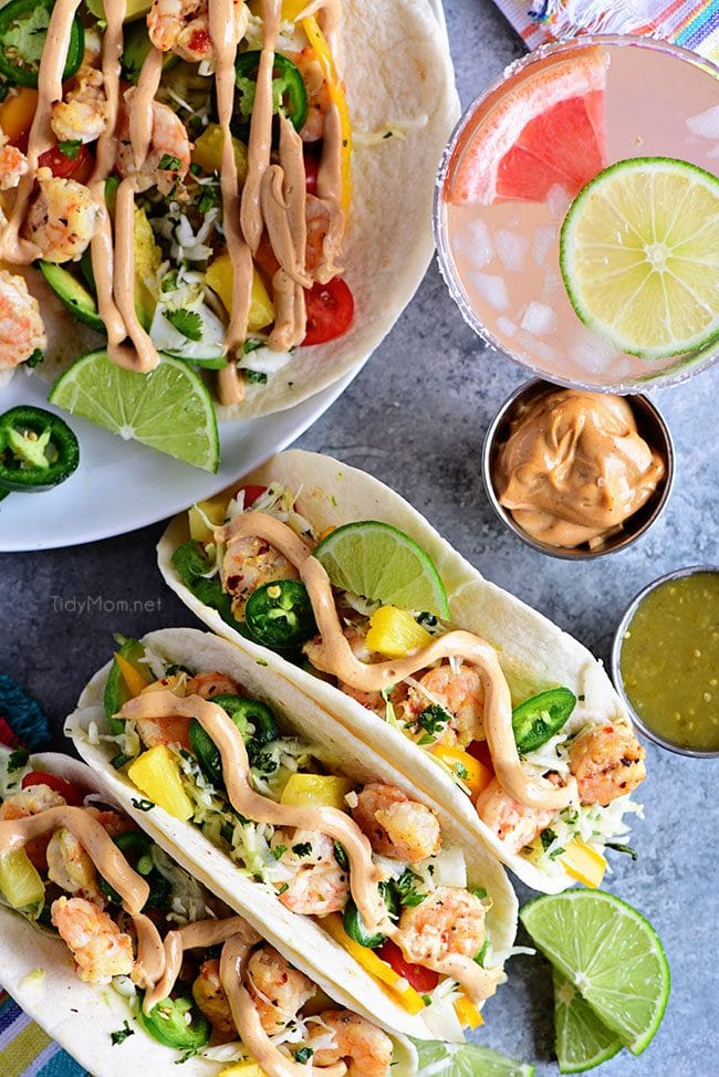 Baja Shrimp Tacos on a plate and on a stand