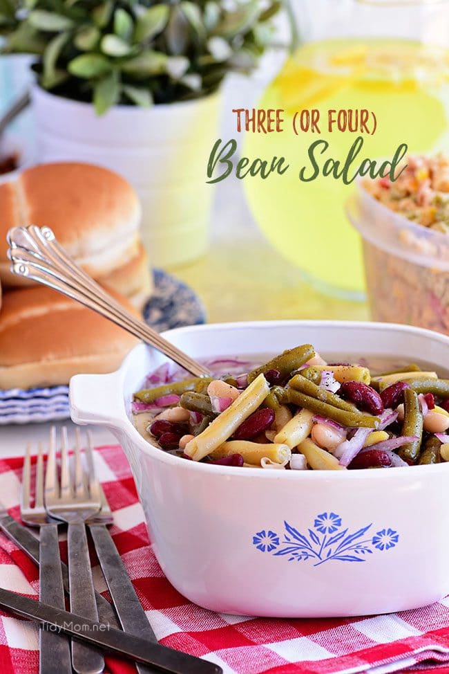 This easy classic Bean Salad recipe is a great side dish in the summer but yet hearty enough for a fall side as well! Quick to make, packed with flavor, and travels well making it perfect for potlucks! Print recipe at TidyMom.net #sidedish #beansalad #summer #potluck #beans