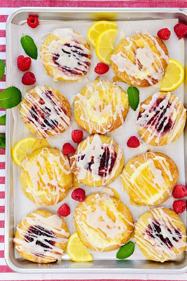 Homemade Cream Cheese Danishes with lemon and raspberry on pan
