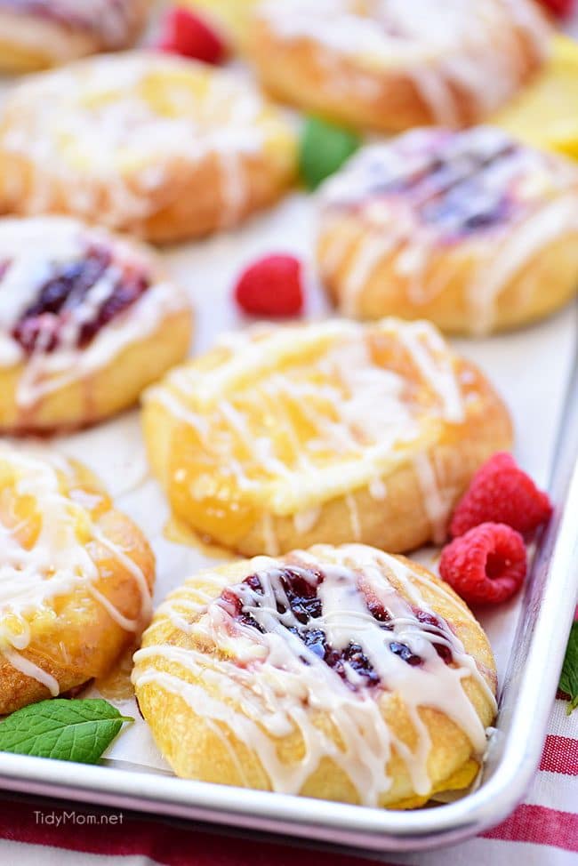 Cream Cheese Danishes with lemon and raspberry on a pan
