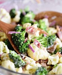 Broccoli Cauliflower Salad on wooden spoon