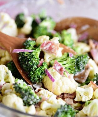 Broccoli Cauliflower Salad on wooden spoon