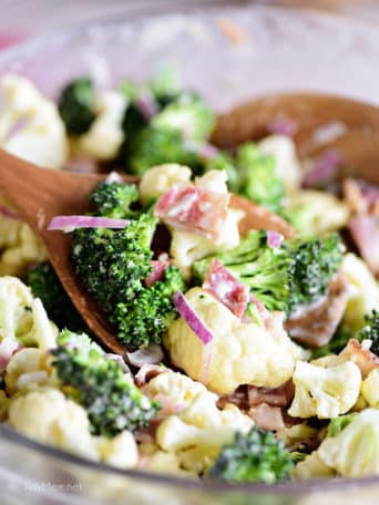 Broccoli Cauliflower Salad on wooden spoon