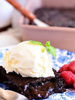 chocolate lava cake on a plate topped with ice cream