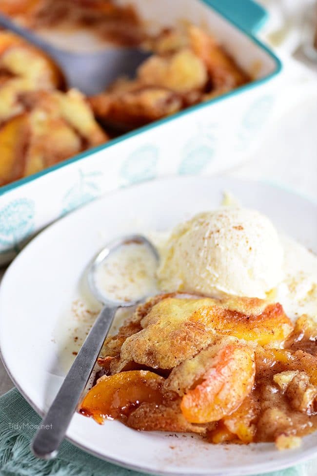 serving of peach cobbler on a white plate