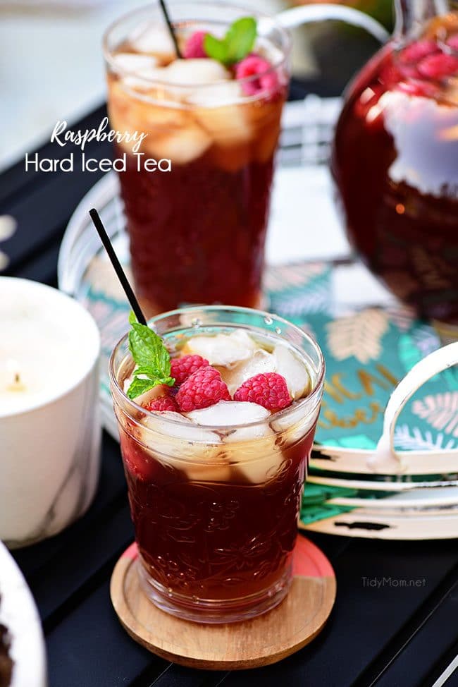 Ice cold Raspberry Hard Iced Tea Cocktail on backyard deck