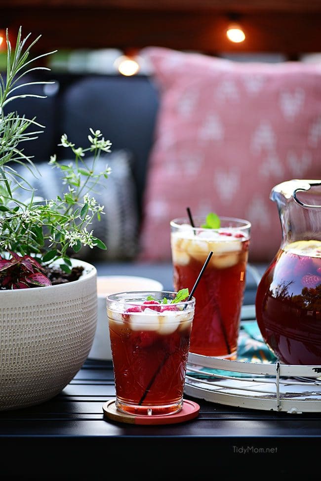 2 glasses and a pitcher of ice cold Raspberry Hard Iced Tea Cocktail