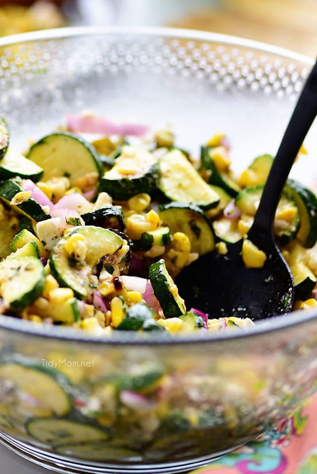delicious grilled corn and zucchini salad in a glass bowl