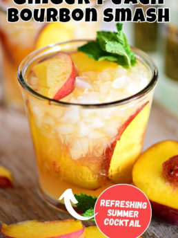 peach cocktail in a glass with fresh peaches
