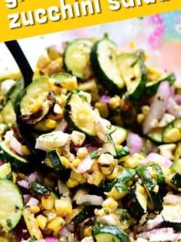 GRILLED CORN AND ZUCCHINI SALAD in a glass bowl
